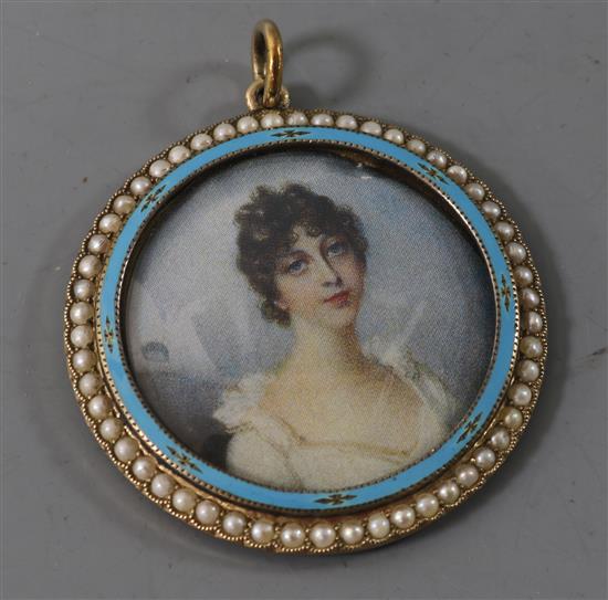 An Edwardian 9ct gold, seed pearl and enamel set locket portrait pendant, 37mm.